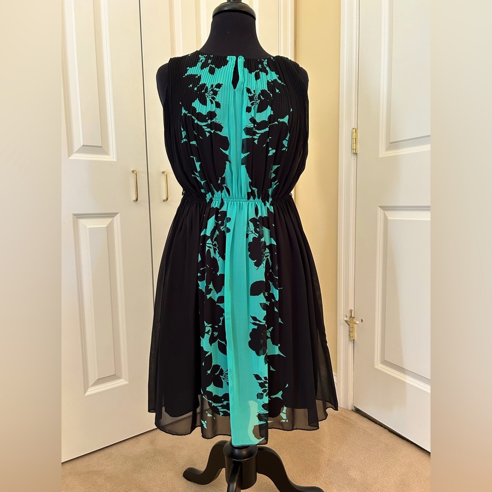 NWT. Sheer over black lining. 100% poly, machine wash. Easter/Work/Church/Party.